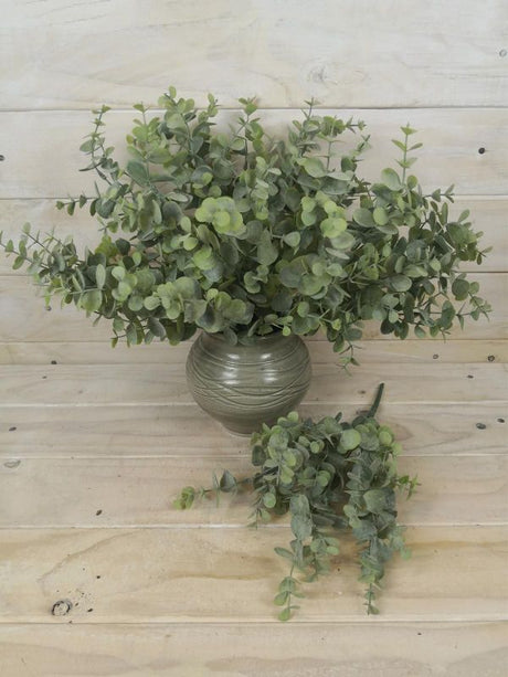Lifelike 34cm artificial eucalyptus bush in green, perfect for enhancing home decor with lasting freshness and elegance.