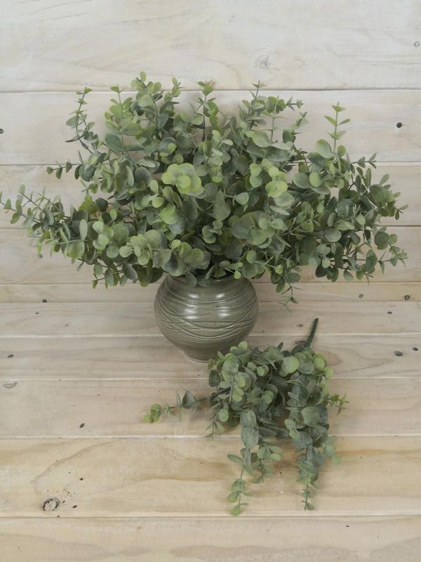 Lifelike 34cm artificial eucalyptus bush in green, perfect for enhancing home decor with lasting freshness and elegance.