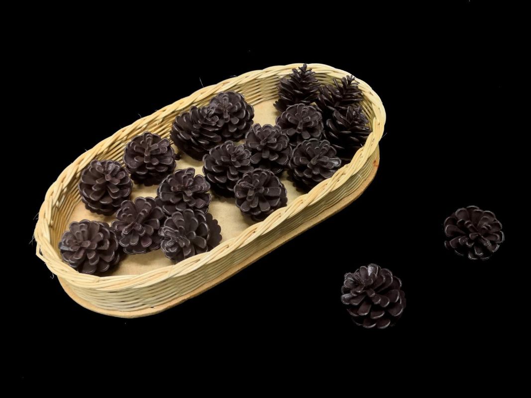 Artificial single plastic pine cone, realistic design for decor, crafts, and holiday displays, durable and maintenance-free.