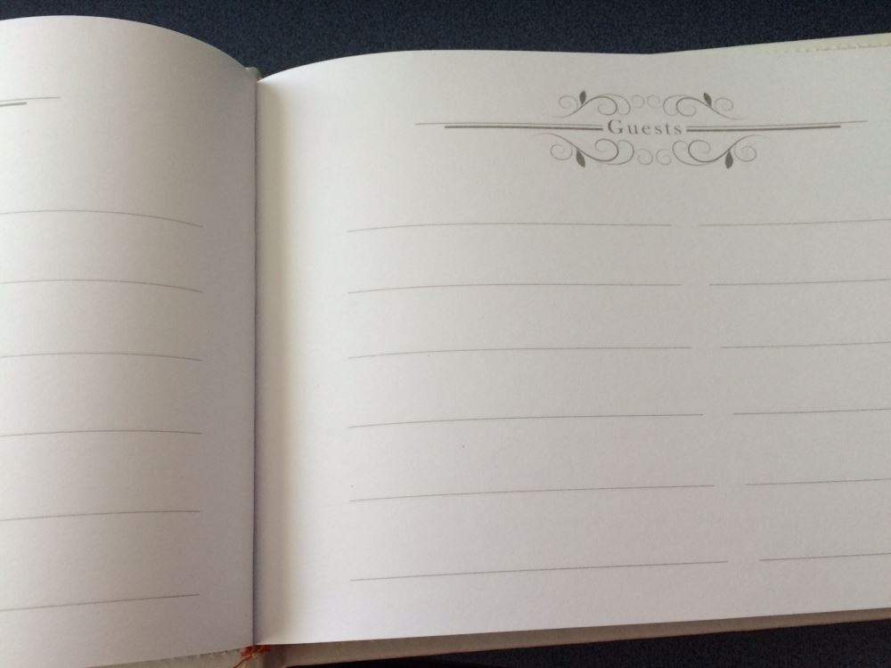 Elegant Christening Day Guest Book with padded hard cover, customizable metal plaque, and space for heartfelt messages.