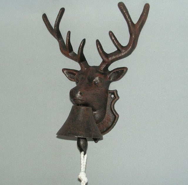 Rustic metal doorbell featuring a charming deer design, crafted from durable wrought iron for indoor and outdoor use.
