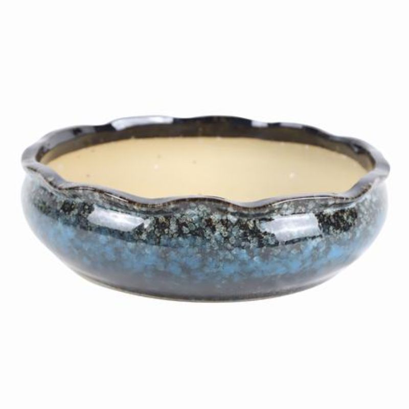 Set of 2 glossy ceramic pots perfect for enhancing home decor and plant display with durability and excellent drainage.