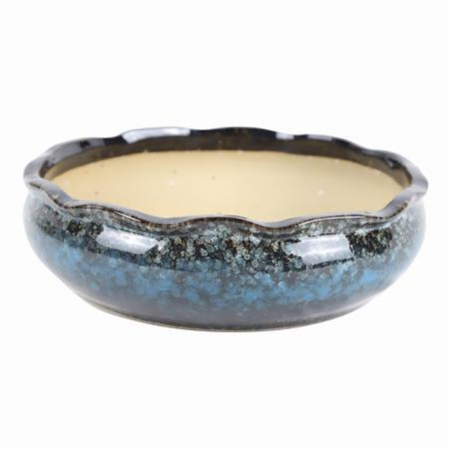 Set of 2 glossy ceramic pots perfect for enhancing home decor and plant display with durability and excellent drainage.