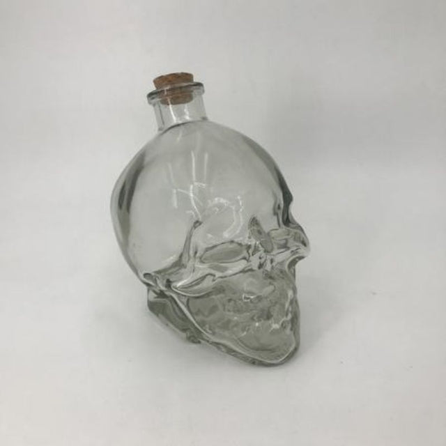 Set of 12 skull-shaped glass bottles, 750ml each, perfect for stylish drink serving and unique home decor.