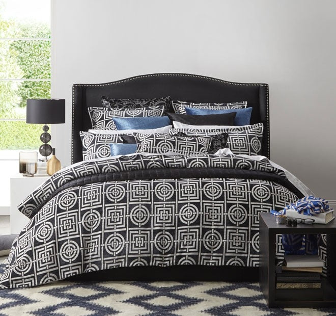 Queen duvet set featuring a striking charcoal geometric design with plush chenille, includes duvet cover and pillowcases.