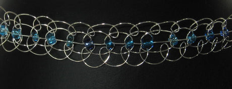 Choker necklace featuring silver loops and vibrant blue accents, perfect for elevating any outfit with elegance and style.