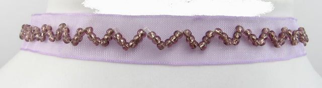 Purple chiffon choker necklace with shimmering beaded zig-zag patterns, perfect for elevating any outfit.