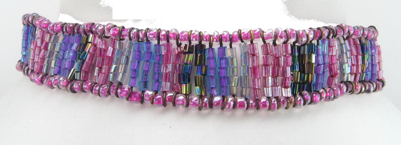 Beaded two-tone pink choker necklace, perfect for layering or wearing solo, adds a chic pop of color to any outfit.