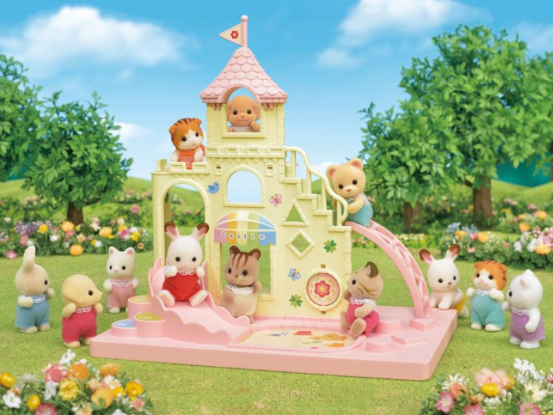 Baby Castle Playground from Sylvanian Families with Chocolate Rabbit Baby, featuring a slide, ladder, and sandbox for imaginative play.