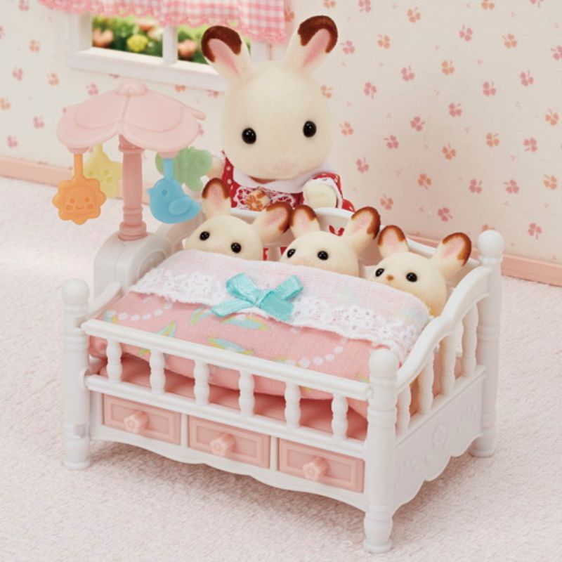 Charming Sylvanian Families crib for triplets with a spinning mobile and versatile bench feature for imaginative play.