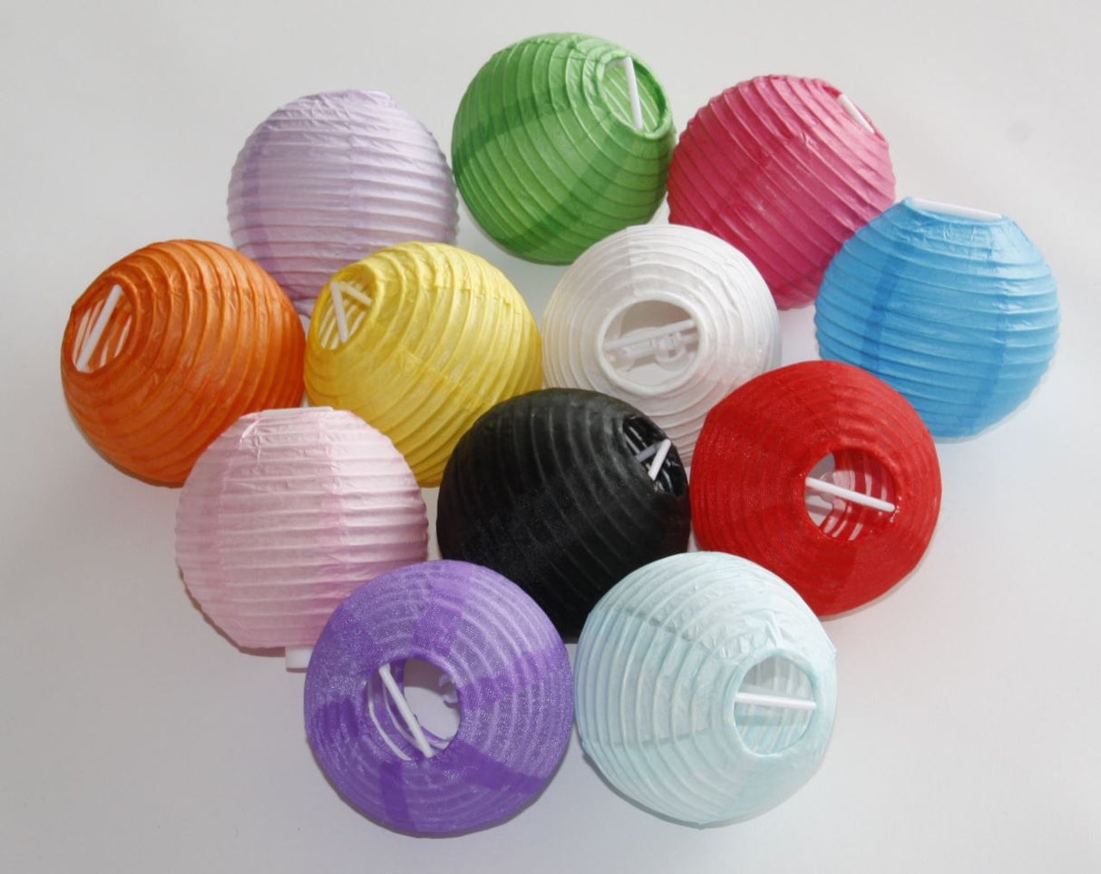 Light pink mini paper lanterns (3" x 24 units) perfect for weddings and parties, adding charm to your event decor.