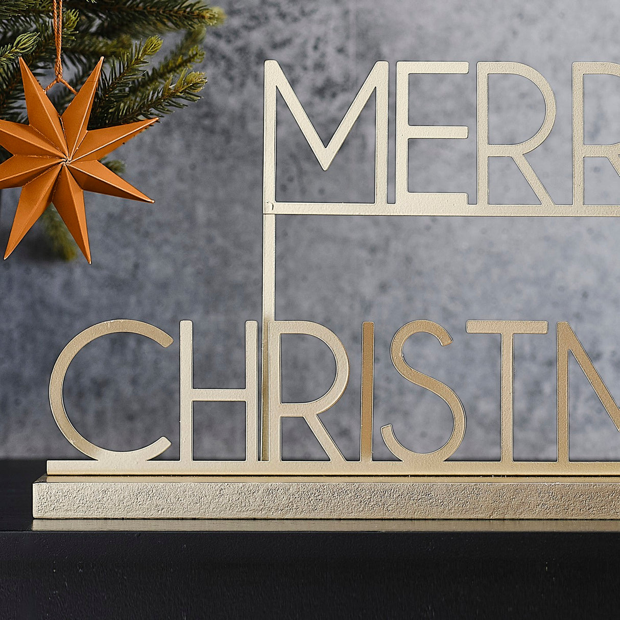 Merry Christmas sign in copper gold metal, 36cm, perfect for festive decor on mantels or tables with a modern Scandi touch.