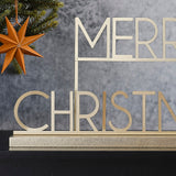 Merry Christmas sign in copper gold metal, 36cm, perfect for festive decor on mantels or tables with a modern Scandi touch.