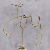 Copper metal tree topper "Joy," measuring 21cm, adds modern charm and coziness to your Christmas decor.