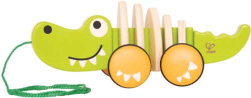 Wooden pull-along crocodile by Hape, featuring a bendy body, cheerful face, and grippy wheels for toddlers' imaginative play.