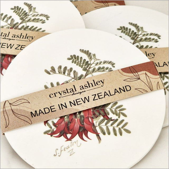 Elegant acrylic coaster featuring Sarah Featon's watercolor illustration of the Kakabeak flower, perfect for home decor.