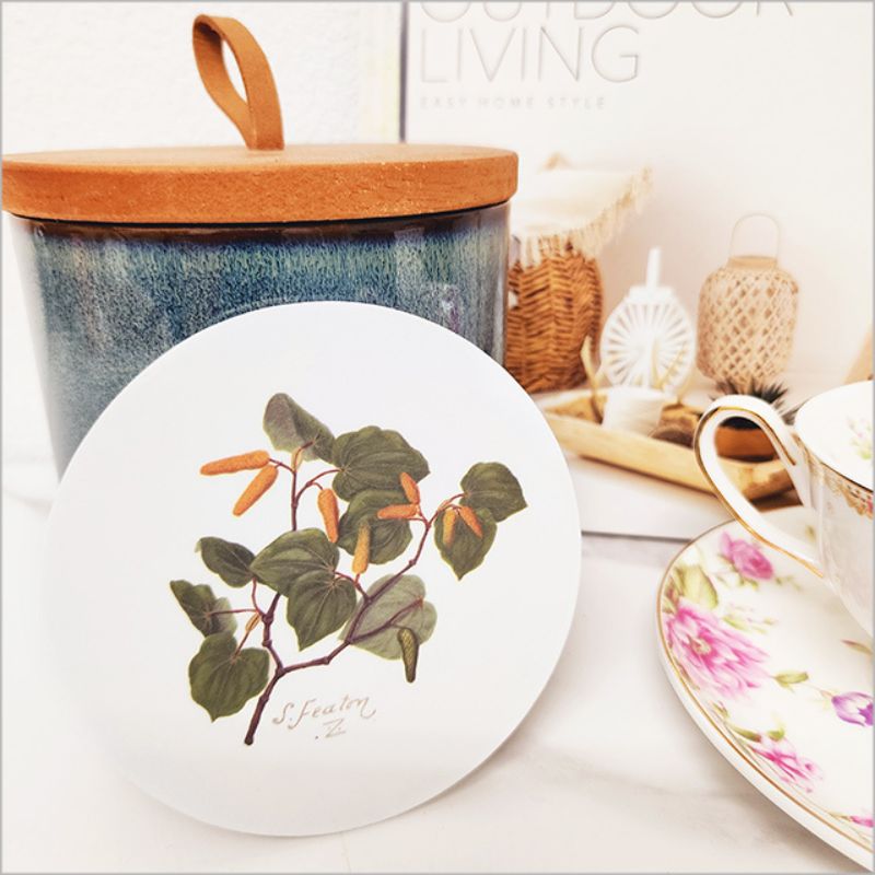 Floral watercolour coaster featuring Kawakawa by Sarah Featon, 10cm, durable acrylic with cork base, easy to clean.