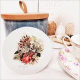 Coaster showcasing Sarah Featon's wildflower watercolor art, 10cm diameter, durable acrylic, cork base, matte finish.