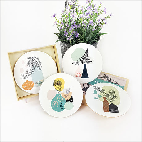 Coasters set featuring vibrant NZ native vases, crafted from acrylic with a cork base, ideal for home decor.