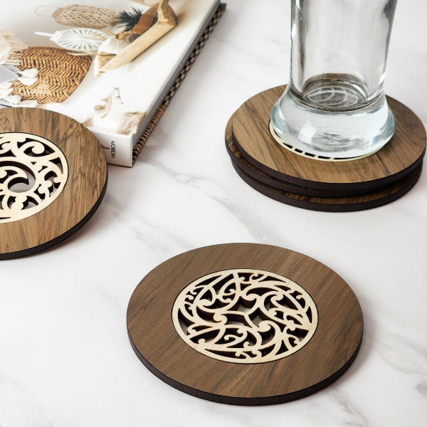 Handcrafted 10cm Kowhaiwhai River Rimu coaster, showcasing unique wood grain and vibrant colors from reclaimed NZ riverwood.