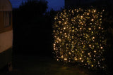 Curtain lights with black cable, 2x2M, featuring 400 warm white LEDs for indoor/outdoor decor, perfect for events and ambiance.