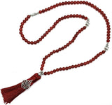 Mala beads necklace made of vibrant carnelian with a Root Chakra charm, perfect for meditation and spiritual healing.