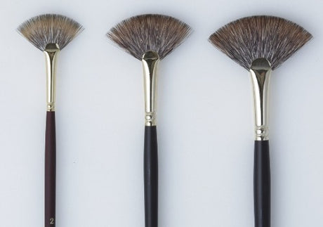 Premium synthetic fan brush with a maroon handle and gold ferrule, perfect for detailed painting and color blending.