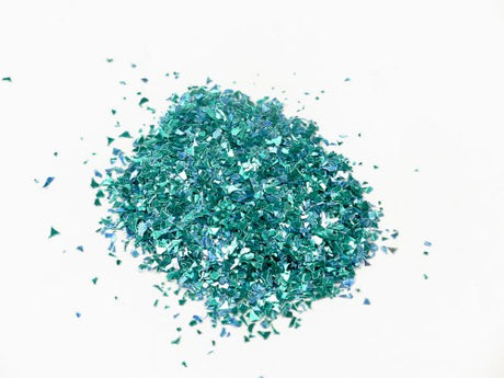 Vibrant turquoise confetti glitter in a 1kg bag, perfect for crafts, celebrations, and DIY projects.