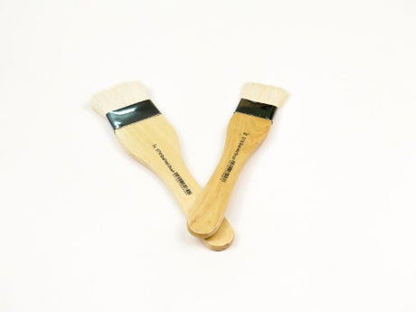 Premium 2" goat hair brush for watercolor, acrylic, and oil painting, featuring a durable wooden handle for artists.