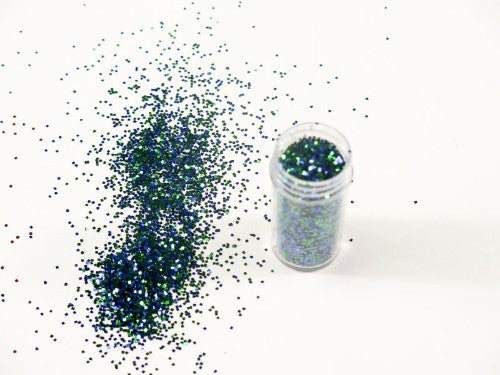 Fine peacock-colored glitter in a 10gm container, perfect for arts and crafts, adding sparkle to projects with precision.