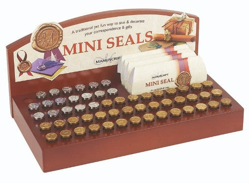 Assorted display of 70 mini metal seals featuring intricate designs for crafting, gift wrapping, and personal projects.