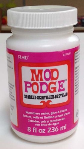 Sparkle Mod Podge 8oz bottle, a shimmery decoupage medium for vibrant crafting on various surfaces. Perfect for jewelry and accessories.