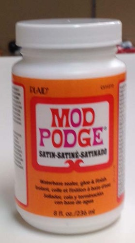 Mod Podge Satin 8oz bottle, versatile all-in-one glue and sealer for smooth, soft finishes in DIY and crafting projects.