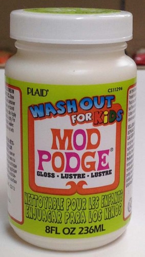 Mod Podge Wash-Out 8oz bottle, ideal for kids' crafting, easily washes out of fabrics and furniture with soap and water.