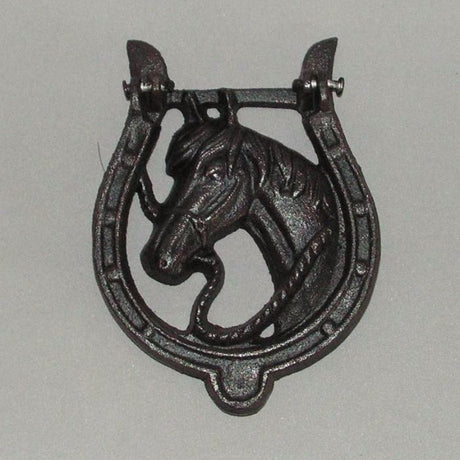 Rustic cast iron horse shoe door knocker, perfect for horse lovers, adds charm and good luck to any entrance.