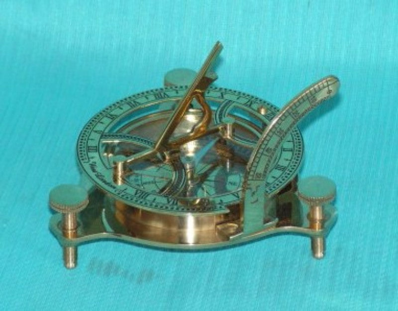 Brass sundial compass measuring 11cm, combines elegant design with functionality for navigation and outdoor decor.