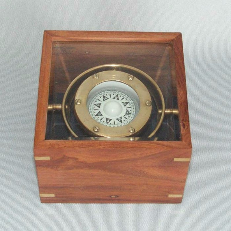 Vintage brass Gimble Compass in an elegant wooden box, ideal for navigation and decor, measuring 11 x 11 x 8 cm.