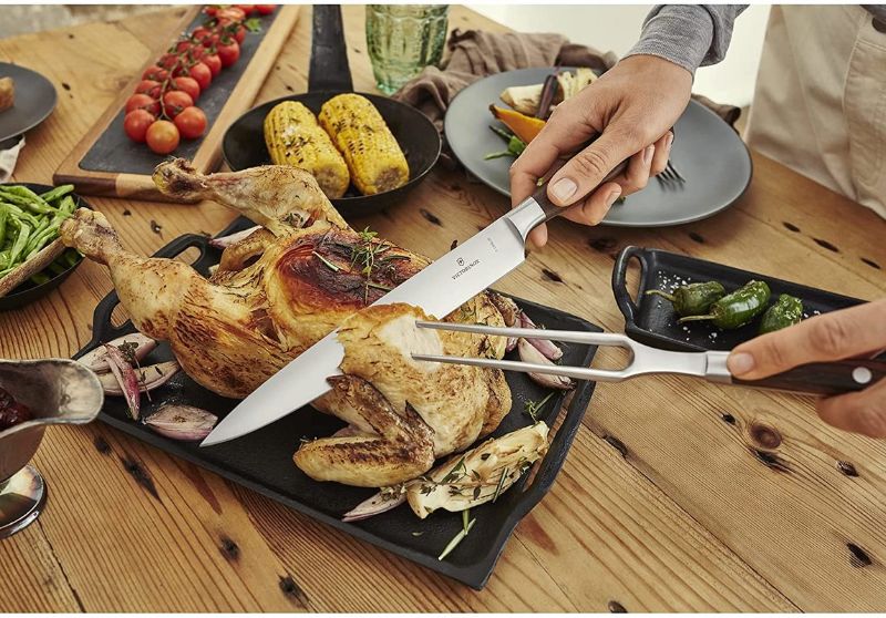 Victorinox Forged Carving Knife with a 20cm stiff blade, ideal for precise slicing and carving of meats.