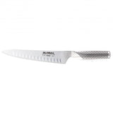 Global G-82 Carving Knife Fluted 21cm with stainless steel blade, ideal for precision slicing and carving in the kitchen.