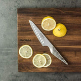 Global GS-92 Cooks Knife Fluted 13cm, featuring a durable CROMOVA 18 stainless steel blade for precision cutting.