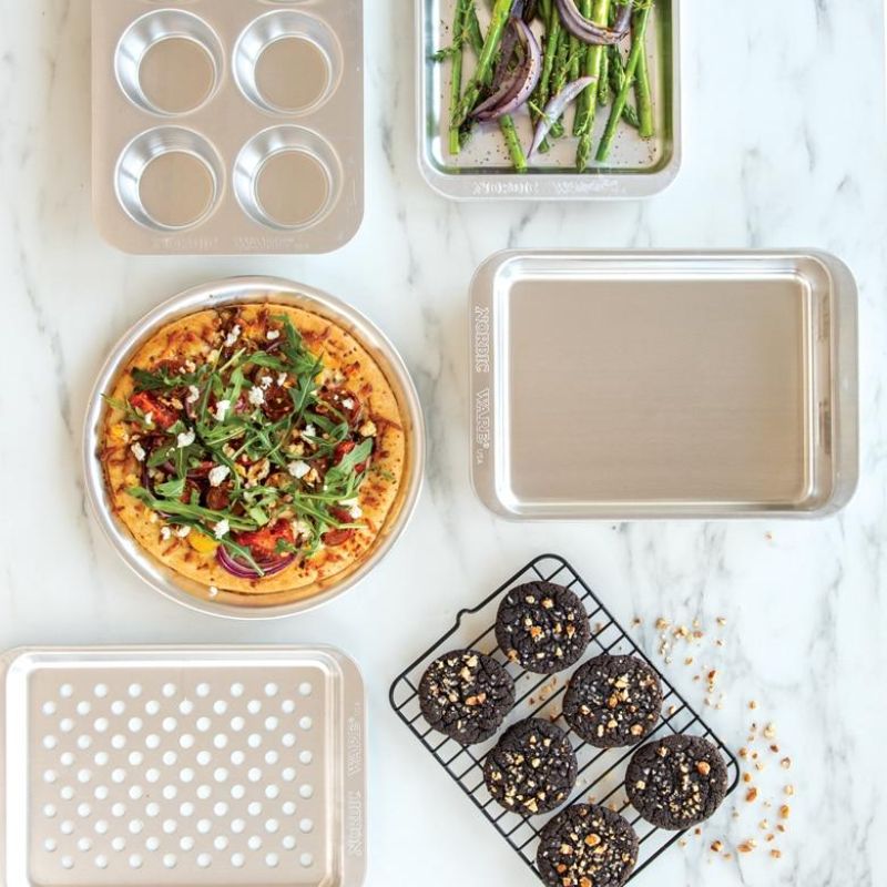 Nordic Ware 9" Hot Air Pizza Crisper with perforations for crispy crusts, perfect for personal pizzas and other snacks.