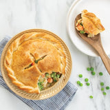 Nordic Ware 5" mini pie pan with nonstick surface and braid detailing, perfect for individual desserts or pot pies.