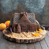 Nordic Ware Gingerbread House Bundt Pan for festive baking, creating beautiful gingerbread house desserts for holiday celebrations.