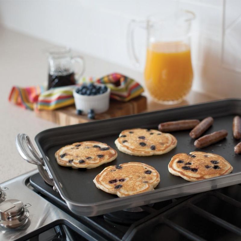 Nordic Ware Two Burner High-Sided Griddle with ergonomic handles, nonstick surface, and ample cooking space for versatile meals.