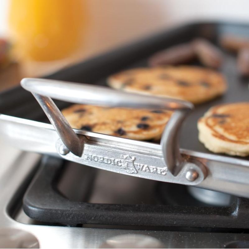 Nordic Ware Two Burner High-Sided Griddle with nonstick surface, heavy aluminum, elegant handles, and ample cooking space.