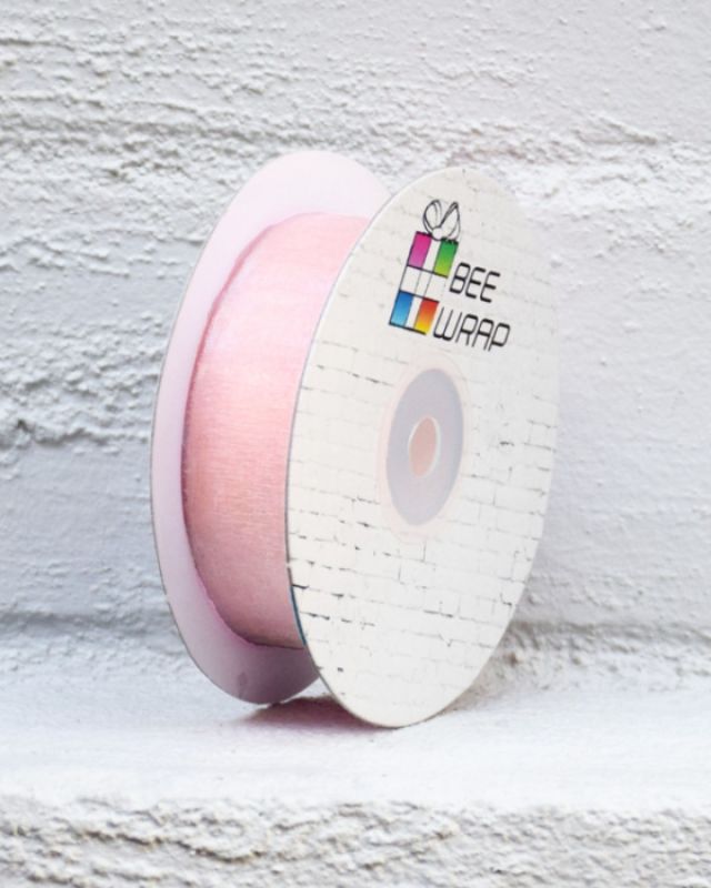 Cut edge organza ribbon in dusty pink, 25mm wide and 50m long, perfect for gifts, weddings, and crafts.