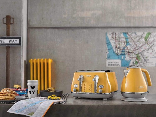 DeLonghi Icona Capitals kettle in vibrant yellow, featuring 1.7L capacity, cordless design, and retro charm for stylish boiling.