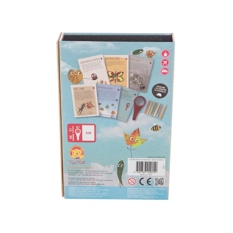 Outdoor Activity Set by Tiger Tribe featuring a magnifying glass, chalks, pencil, and activity book for outdoor exploration.