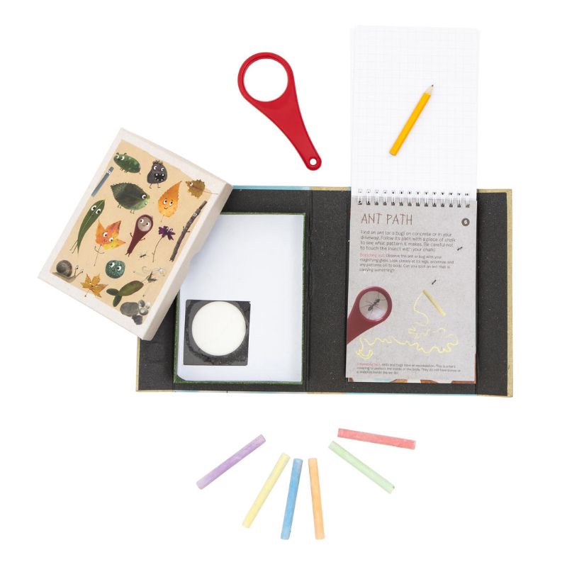 Outdoor Activity Set by Tiger Tribe featuring a magnifying glass, colored chalks, and activity book for creative outdoor exploration.