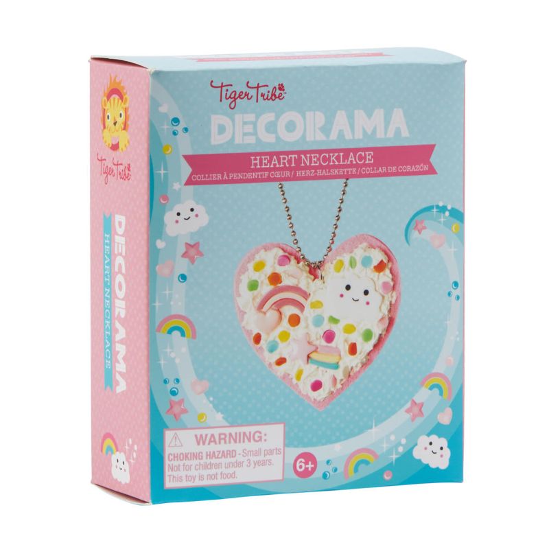 DIY heart necklace kit for kids, includes pink felt pendant, Deco Cream, sprinkles, and colorful charms for creative fun.